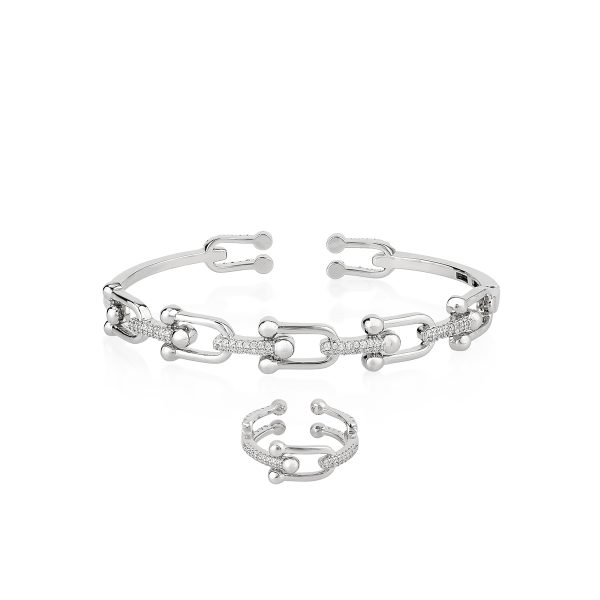 Silver tone bangle and ring set with bezel-set stones in a sleek modern orbit design.