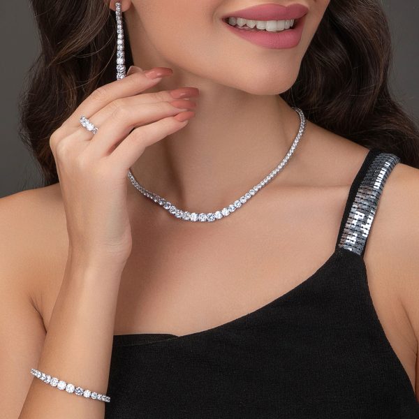 Royal Tennis Elegance Ensemble – Four-Piece Jewelry Set featuring necklace, earrings, bracelet, and ring with brilliant stones.
